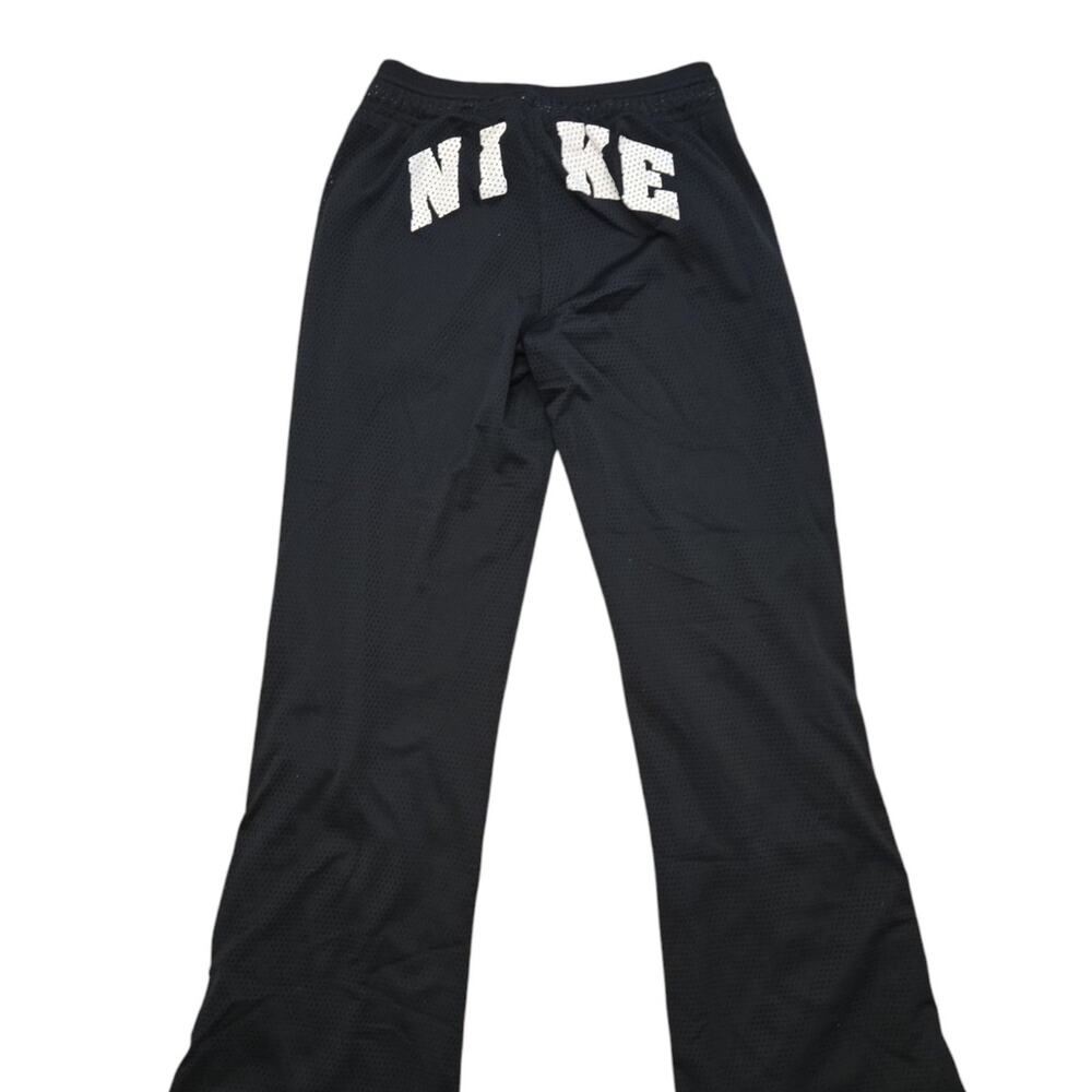 Nike girl's sz large mesh lined snap side big back logo flare pants